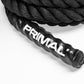 A close up of the handle of a sled pull rope with white branding printed on it.