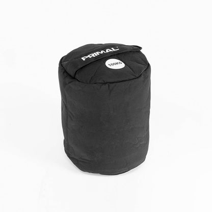 A 100kg black sandbag with handle for strongman workouts.