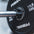 Close up view of a magnetic lockjaw collar securing a bumper plate in place on a barbell.