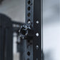 A magnetic lockjaw collar stuck to a steel gym rack frame.