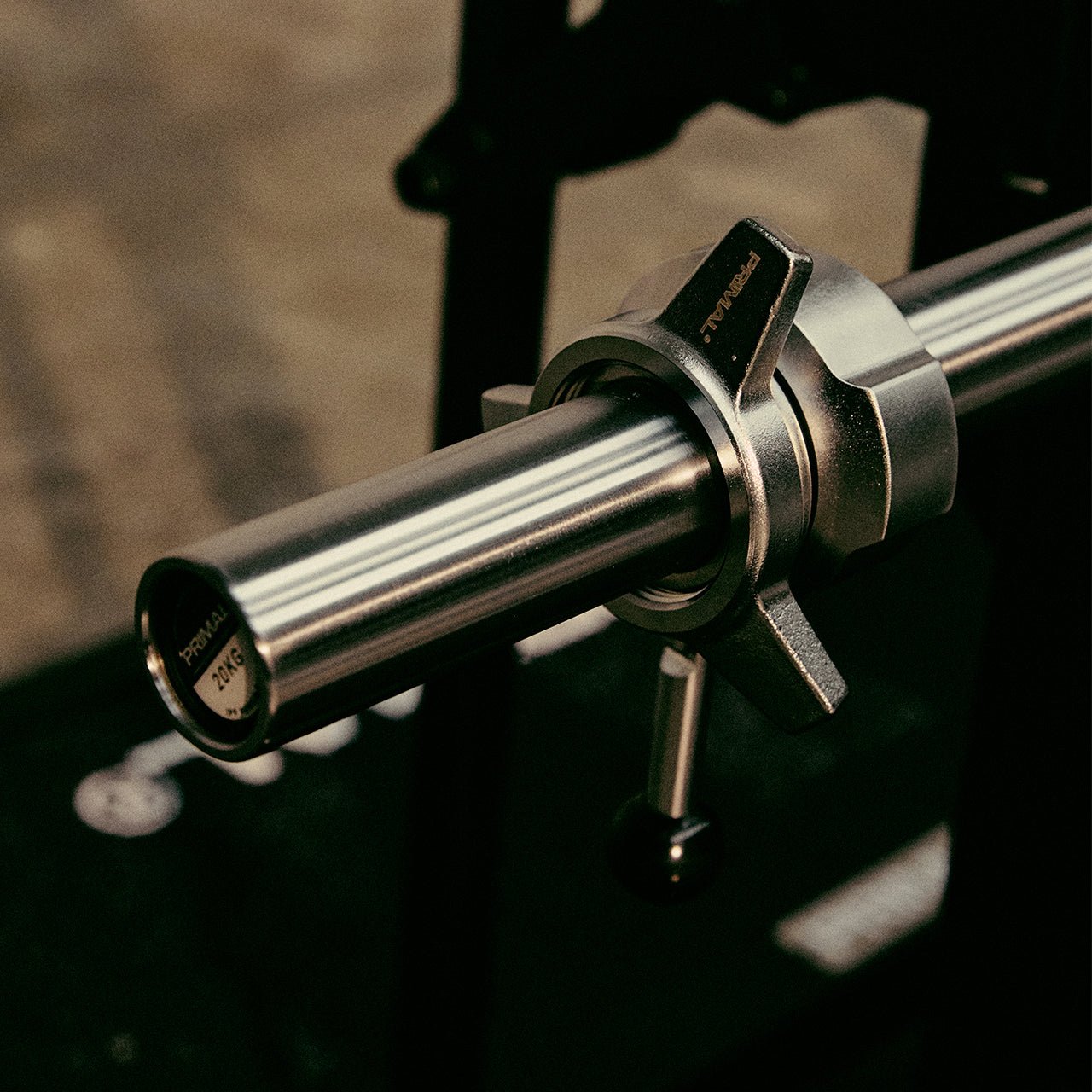 A powerlifting barbell with a competition-grade collar attached.