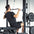 An athlete doing a lat pulldown on a half rack.