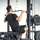 An athlete doing a lat pulldown on a half rack.