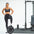 An athlete showing the landmine attachment on a half rack.