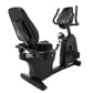 An indoor recumbent exercise bike.