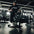 An athlete using a seated calf raise machine loaded with weight discs.
