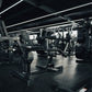 A plate loaded seated calf raise machine in a gym.
