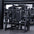 Angled view of plate-loaded pullover machine in gym setting.