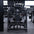 Straight on view of plate-loaded pullover machine in gym.