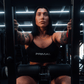 Close up view of athlete using plate-loaded standing hip thrust machine.