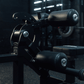 Close up view of adjustable pads on plate-loaded standing hip thrust machine.