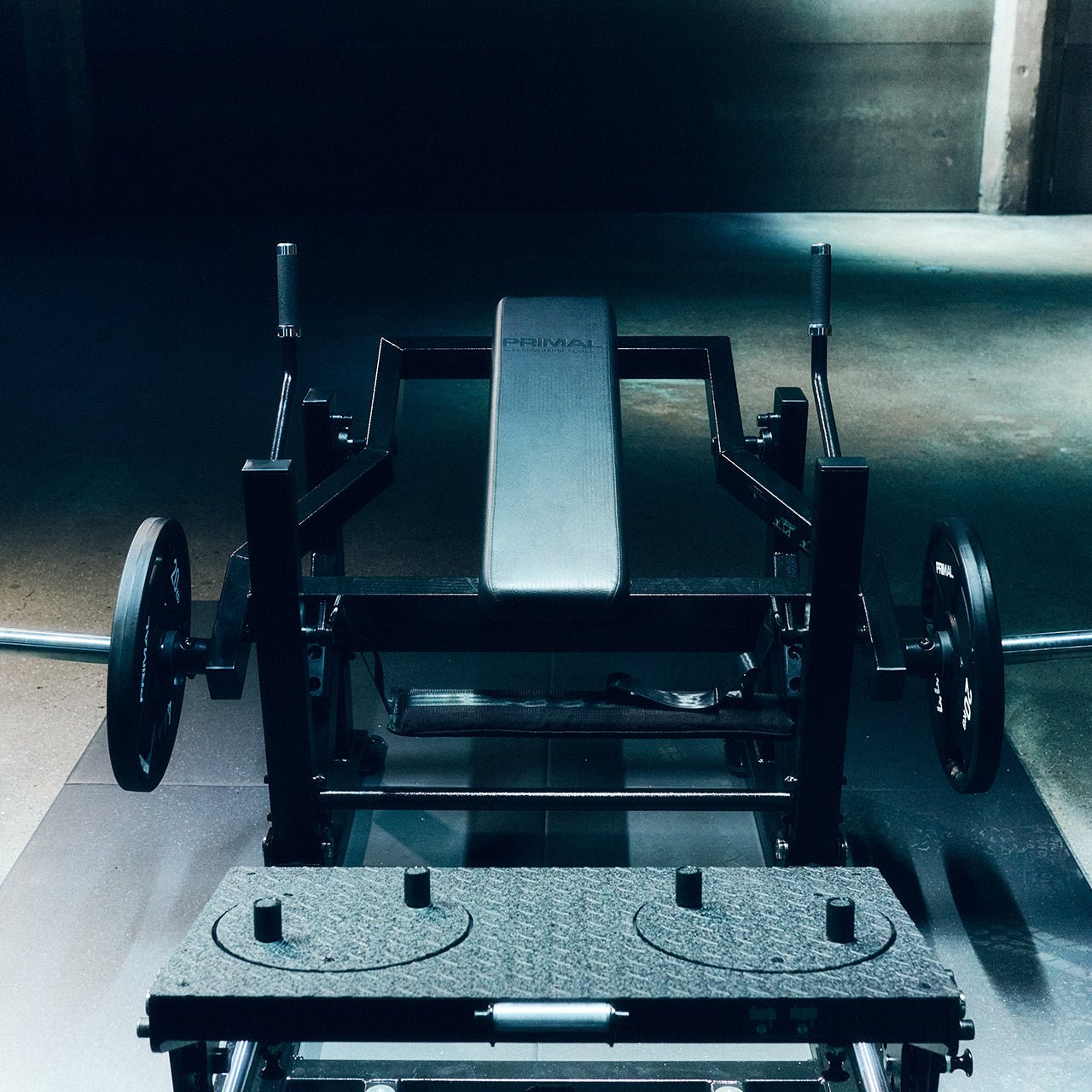 A front on image of a glute drive/hip thrust machine in a gym.