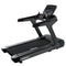 Black treadmill with digital console on a white background, branded 'Primal'.