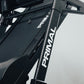 Close-up of a folding treadmill frame with 'Primal' branding on a light gray background
