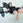 An athlete using a hip thrust pad attachment with barbell on a weight bench.