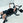 An athlete using a lateral raise attachment on a weight bench.