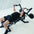 An athlete using a lateral raise attachment on a weight bench.