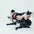 An athlete using a hamstring curl attachment on a weight bench.