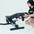 An athlete adjusting the angle of a weight bench.