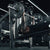 An athlete performing a decline bench press with a loaded barbell.
