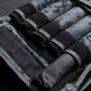 Close up the 2kg weight packs stored inside a 20kg camouflage weighted vest.