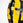 Yellow and black weightlifting plate with '15kg' and '33lbs' text on a white background