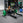 a woman performing hip thrusts with a hip thrust barbell and floor hip thrust bench