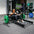 a woman performing hip thrusts with a hip thrust barbell and floor hip thrust bench