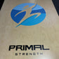 a custom olympic lifting platform with the primal strength logo