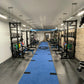 a custom blue gym astroturf track in a gym