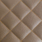 a custom orange stitching pattern on brown leather