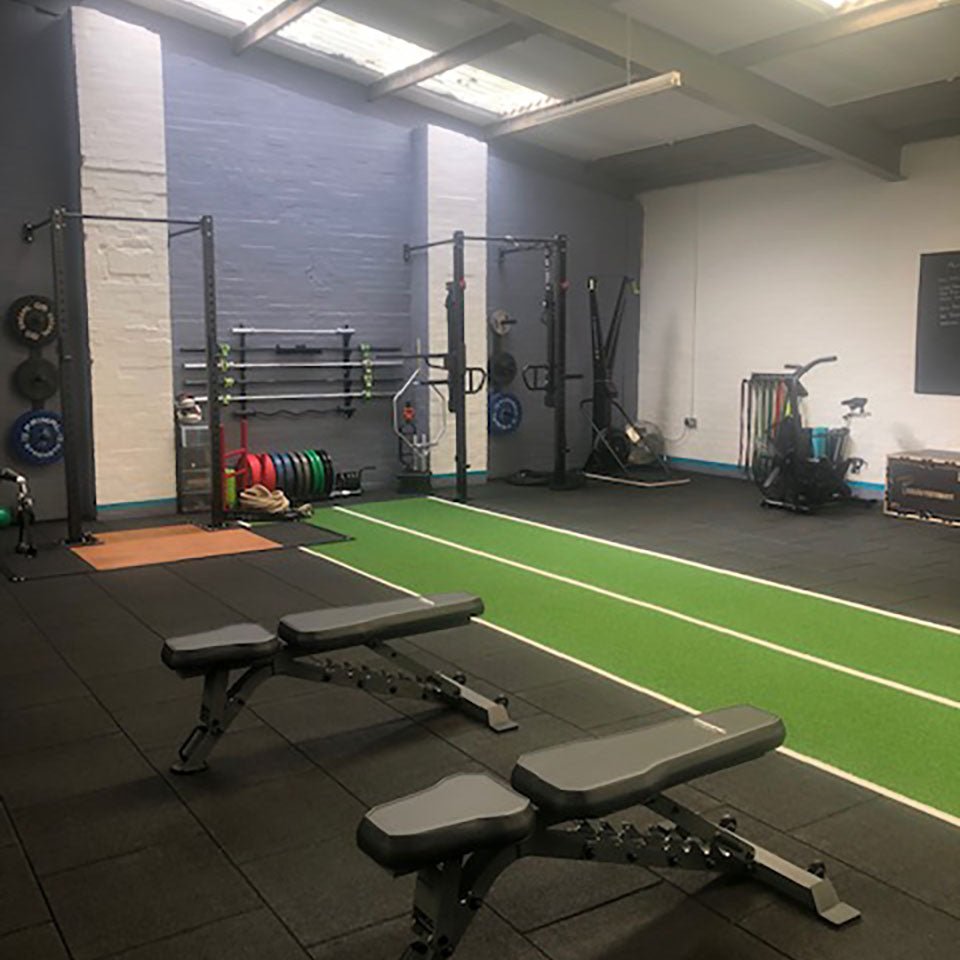 a green gym astroturf track in a gym
